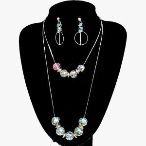 Three piece jewelry set in antique gold finish