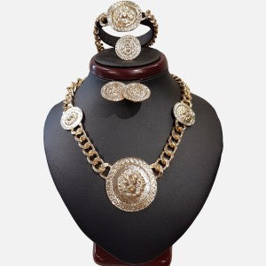 Five piece jewelry set in gold frame