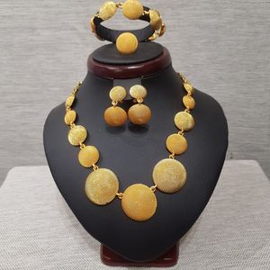 Full view of multiple textured discs five piece jewelry set