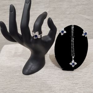 Four piece jewelry set with clear and blue stones