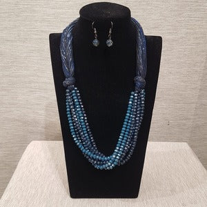 Three piece jewelry set with multistrand beaded necklace