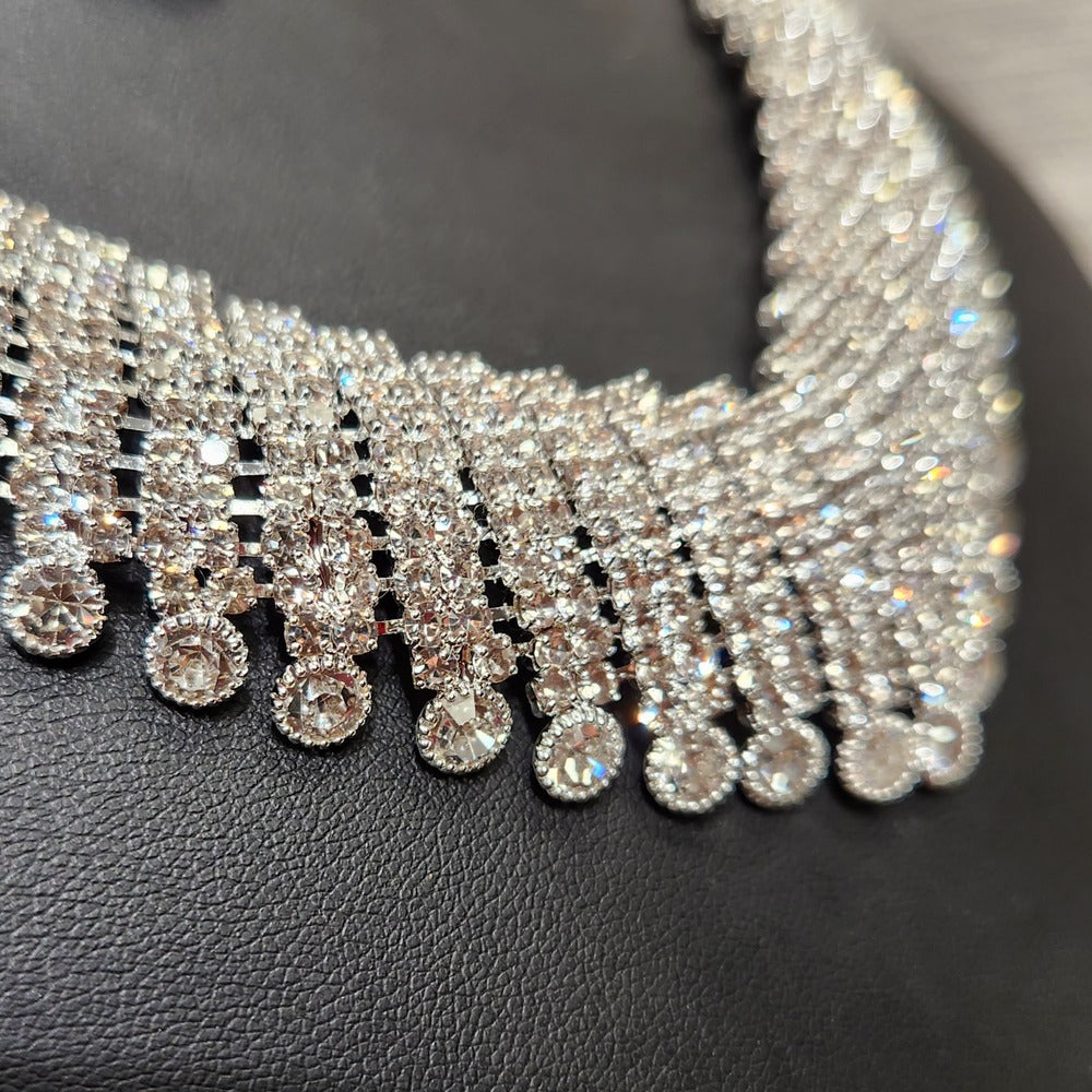 Detailed side view of clear stone embellished necklace