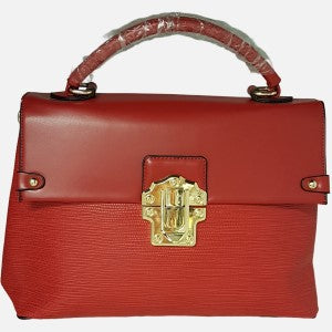 Artificial leather handbag in red with top handle and shoulder strap.