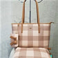 Front view of beige and cream checkered handbag