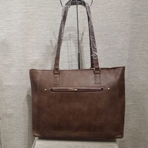 Front view of brown colored handbag