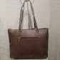 Back view of brown colored handbag