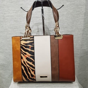 Detailed view of Fashion handbag with colorful panels and brown wallet 
