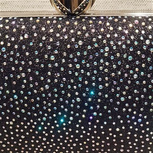 Detailed view of AB stones on black party purse 