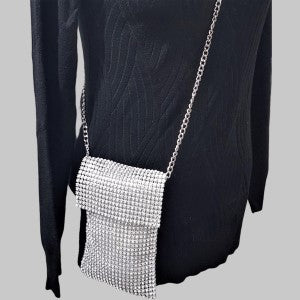 Small silver side bag in mesh material, adorned with sparling silver stones and a chain strap