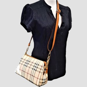 Plaid pattern side bag with tan shoulder strap