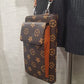 Closer view of brown and tan print small side bag