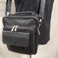 Detailed view of multi-pocket side bag with top handle