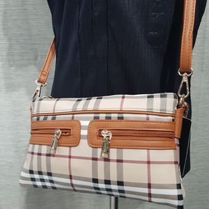 Detailed view of plaid pattern side bag