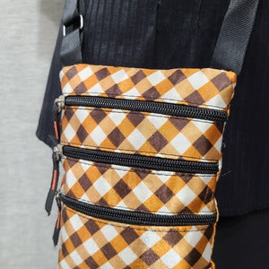 Closer front view of Checker print small side bag 