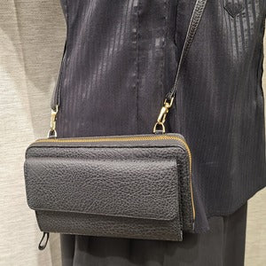 Closer view of Black side bag with adjustable shoulder strap