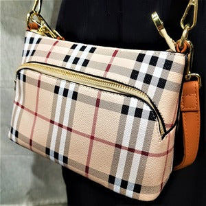 Front zipper compartment on plaid pattern side bag