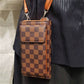Detailed view of Checkered print small side bag with cell phone compartment