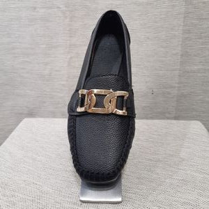 Front view of black color loafer with gold color fancy buckle