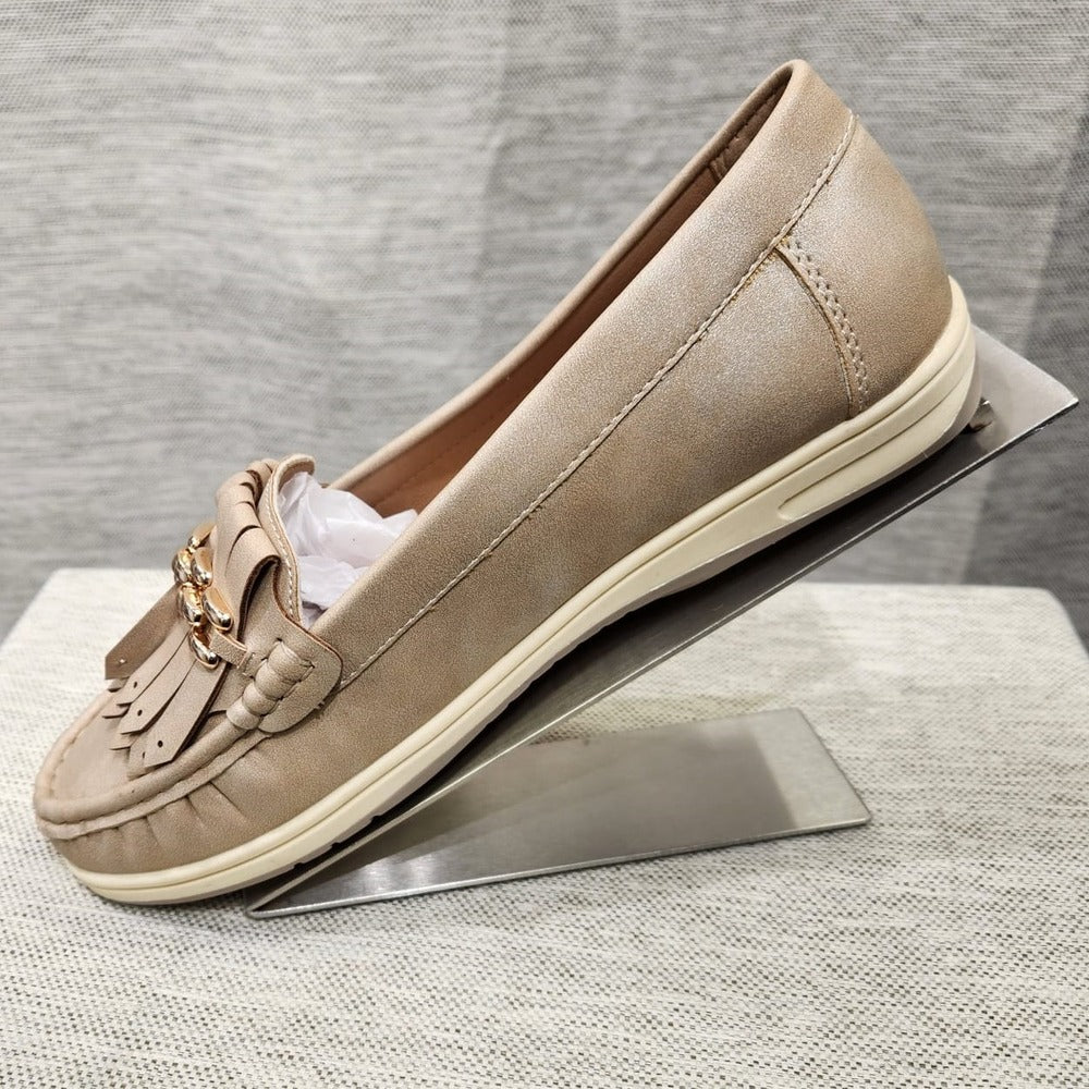 Side view of light gold color flat shoes for women