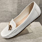 Side view White color flat shoes for women with gold buckle