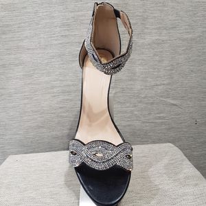 Front view of black color stone embellished platform heels
