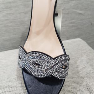 Stone embellished strap of black platform heels