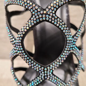 Detailed view of AB stones on black party heels