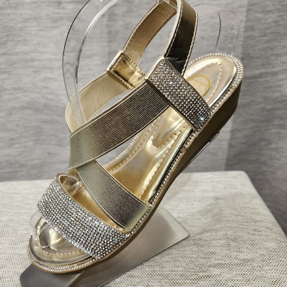 Side view of gold summer sandals with clear stones and sling back