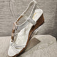 Side view of White upper summer sandals with sling back