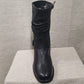 Front view of Black color midcalf length winter boots for women
