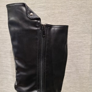 Details of long fashion boots
